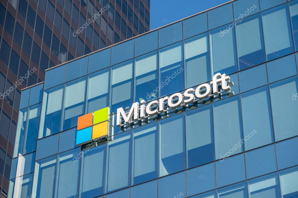 Vancouver, British Columbia - May 25, 2023: Microsoft logo on the side of a office building at sunset.