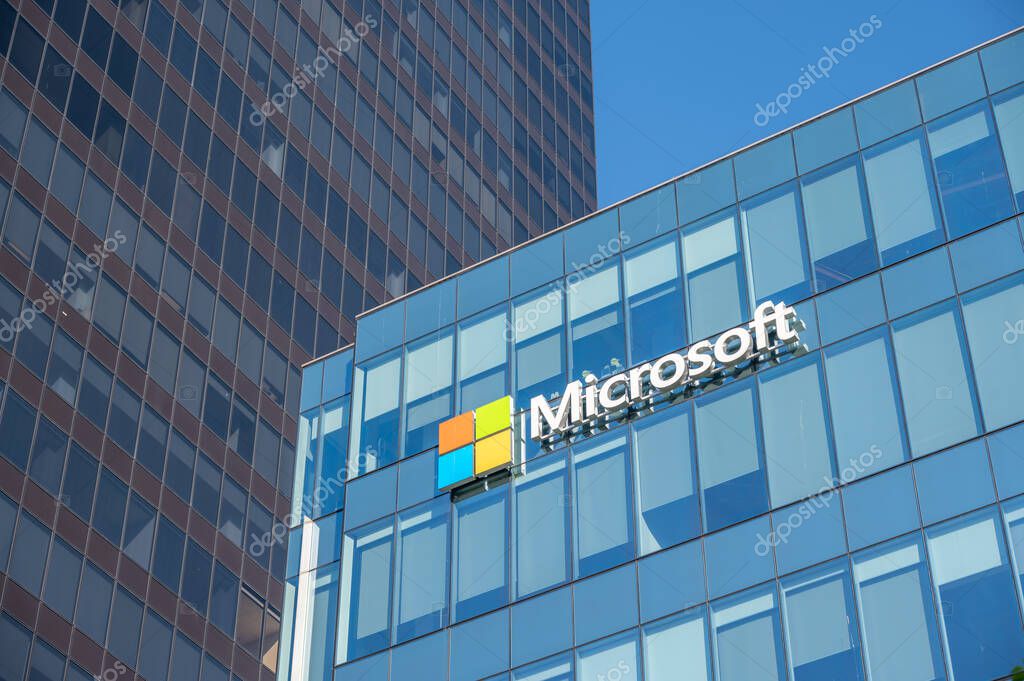 Vancouver, British Columbia - May 26, 2023: Microsoft logo on the side of a office building at sunset.