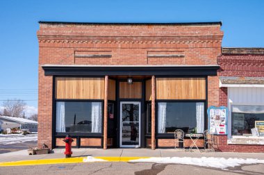 Nanton, Alberta - March 30, 2024: Old brick storefront in downtown Granum. clipart