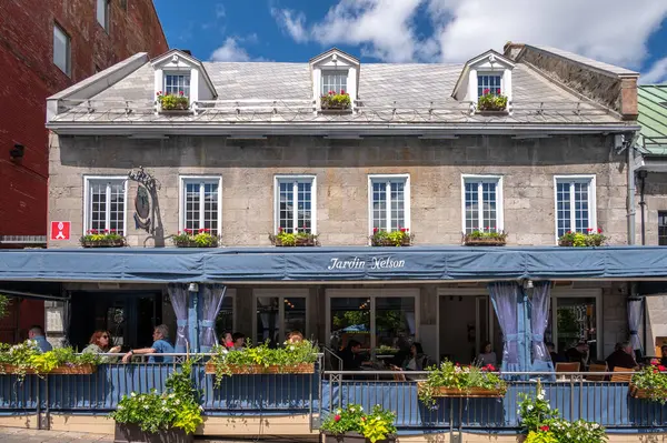 stock image Montreal, Quebec - May 24, 2024: Jardin Nelson restaurant on Place Jacques Cartier in Old Montreal.