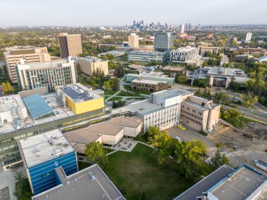Aerial view of the University of Calgary campus with skyline in the distance.
