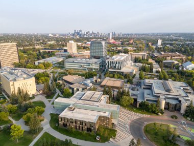 Aerial view of the University of Calgary campus with skyline in the distance.