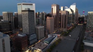 Aerial view of skyscrapers at night in Calgary, Alberta's booming downtown core.