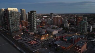 Aerial view of skyscrapers at night in Calgary, Alberta's booming downtown core.