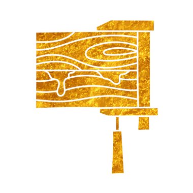 İki ahşap kırıntısı, klemp ile tutturulmuş ve altın rengi çizilmiş.