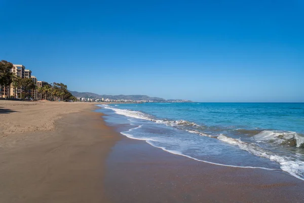 stock image A wide sandy beach of the Mediterranean Sea in Spain. A sunny warm spring day.