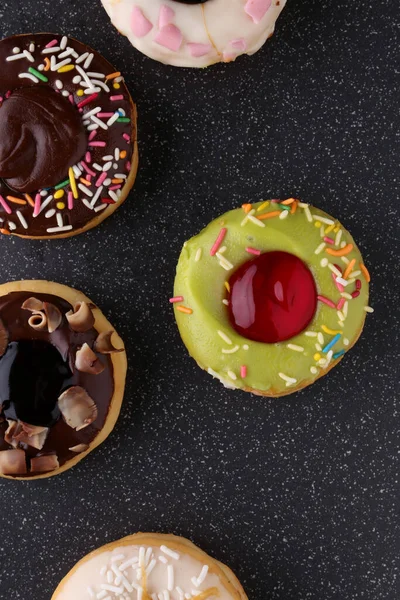 Stock image assorted donuts with  sprinkles 