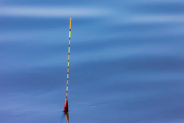 stock image Beautiful fishing float is on the lake and waiting for the fish bite