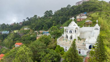 Aerial view of kv paradise in aizawl the capital city of mizoram, this architectural establishment gives an amazing view of hills and the green mizoram in north-east India clipart