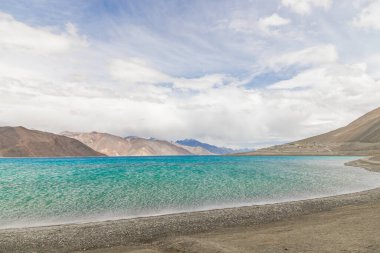 Beautiful landscape with mountains on the lake named Pagong Tso, or Pagong Lake, situated on the border with India and China, Leh, Ladakh, India. one of the world's highest brackish water lakes. clipart