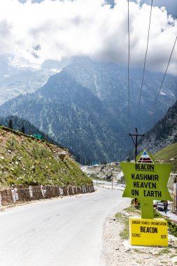 Sonamarg, Kashmir, India 20 July 2022. Kashmir Heaven on Earth signboard by Border Roads Organisation on the NH 1 Srinagar-Leh highway in Jammu and Kashmir, India. clipart