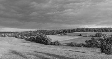 scenic rural landscape with fields,forest and green meadows in the Taunus area in Germany