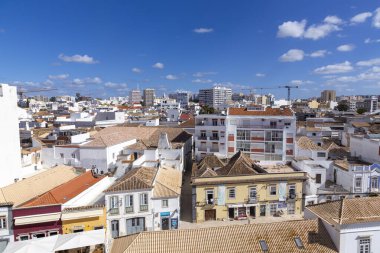 Faro, Portugal - October 3, 2020: view to old town of Faro, Portugal, Algarve with mixture of modern and old traditional architecture.