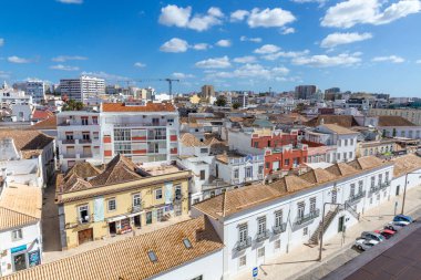 Faro, Portugal - October 3, 2020: view to old town of Faro, Portugal, Algarve with mixture of modern and old traditional architecture.
