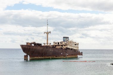 old rusty sunken ship wreck in the harbor of Arrecife in Lanzarote, Spain
