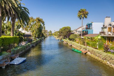 Venice, USA - July Y 6, 2008: old canals of Venice, build by Abbot Kinney in California, beautiful living area with boats and residential houses.