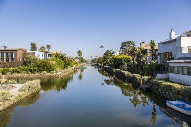 Venice, USA - July Y 6, 2008: old canals of Venice, build by Abbot Kinney in California, beautiful living area with boats and residential houses.