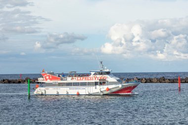 Orzola, Spain - January 30, 2023: ferry from La Graciosa enters the harbor of Orzola, Spain.