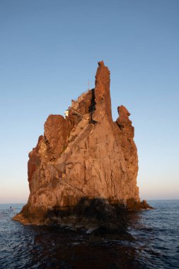 small island of strombolicchio, a tiny volcanic island next to the volcanic island stromboli in Italy