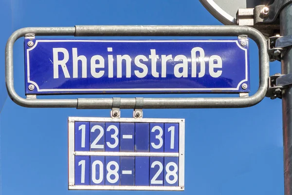 old enamel street name sign Rheinstrasse - engl:  river Rhine street - in Wiesbaden, Germany.