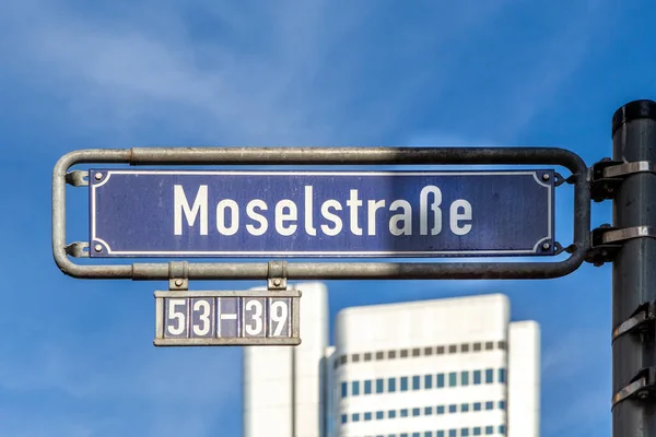 old enamel street name sign Moselstrasse in english: street of river Mosel - in Frankfurt, Germany