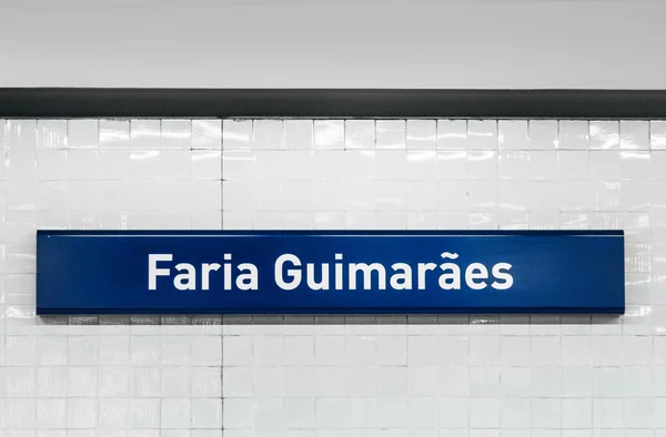 stock image signage of metro station Faria Guimaraes in Porto, Portugal on white tiles