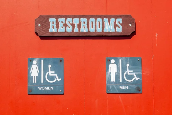 Sign Restroom Metal Red Wall Shadow — Stock Photo, Image
