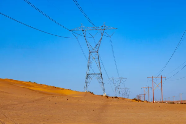 Electric Pylon Desert Wooden Pile Blue Sky — Stock Photo, Image
