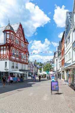 Montabaur, Germany - June 15, 2023: people enjoy visiting old town of Montabaur with lovingly restored half-timbered buildings from the 16th and 17th centuries. clipart