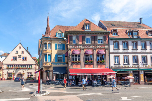 Munster, France - June 21, 2023: street scene with historic houses in Munster, France, in the Haut-Rhin department in Grand Est in Northeastern France.
