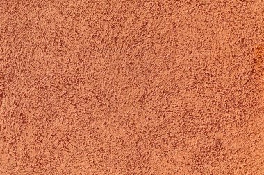 Almanya 'da kırmızı alçı duvar arka planının harmonik deseni