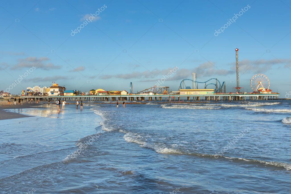 Galveston, USA - October 28, 2023: Pleasure Pier from the water in Galveston Island, Texas, USA.
