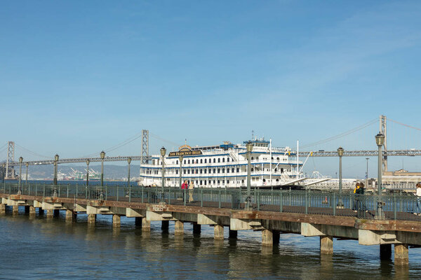 San Francisco, USA -May 20, 2022: San Francisco Belle cruise ship. View from the pier. Walk along the embankment of the city