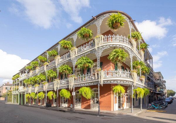 old french building with typical iron balconies in the french quarter in New Orleans, Louisiana, USA