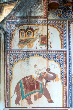 Nandawa, India - February 10, 2024: old traditional  paintings at a historic Haveli in Mandawa clipart