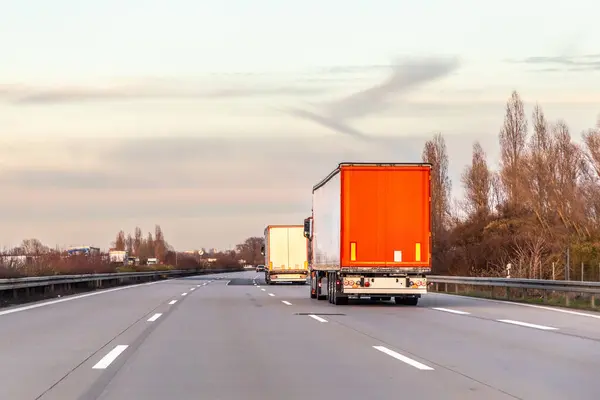 Trucks Highway Moody Sunset Sky — Stock Photo, Image
