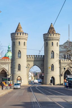 Potsdam, Germany - March 30, 2024: scenic view from Fiedrich Ebert street to Nauener Tor -Nauen Gate- in Potsdam. It is one of the three preserved gates of Potsdam, Germany and was built in 1755. clipart