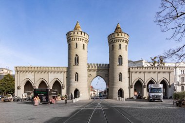 Potsdam, Germany - March 30, 2024: scenic view from Fiedrich Ebert street to Nauener Tor -Nauen Gate- in Potsdam. It is one of the three preserved gates of Potsdam, Germany and was built in 1755. clipart