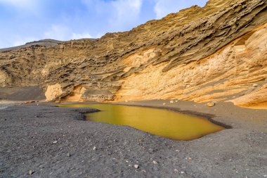 View of Lago Verde volcanic lake, El Golfo. Lanzarote. Canary Islands. Spain clipart