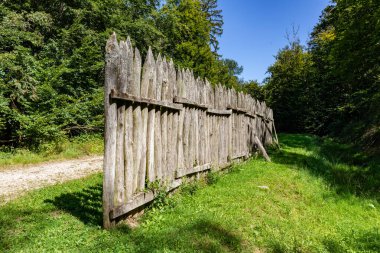 wooden palisades at the safety wall Limes in Bad Homburg to protect the roman part of allemannia, the former roman province clipart