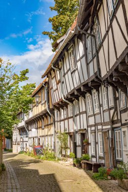 scenic old half timbered houses of poor people in the historic Adolfstrasse in Detmold, Germany clipart