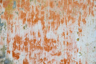 Değişik renklere sahip eski renkli alçı duvar deseni ve armonik arkaplan olarak boya zamanı ve geçmişi sembolize ediyor.