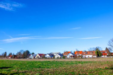 suburban area of munich with fields and family houses at horizon, Munich, Allach, Germany