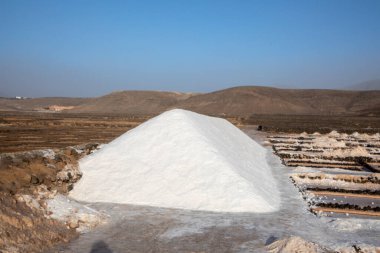 scenic salt mine basins with water mill at Janubio, Lanzarote, Canary islands, Spain clipart