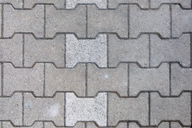 Yerdeki gri taşların harmonik deseni pürüzsüz teknik katmanında.