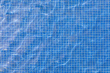 mavi havuz fayanslarının zeminine harmonik şeffaf görünümün arkaplanı