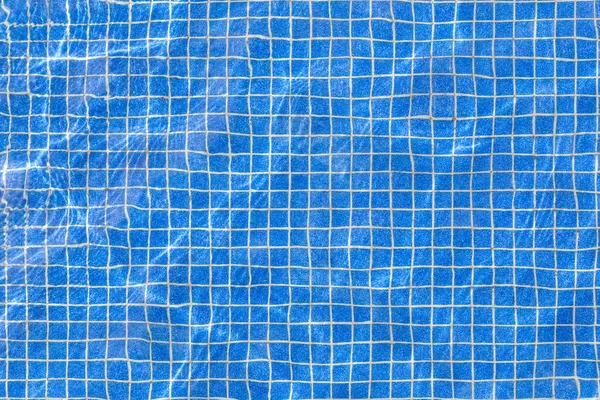 mavi havuz fayanslarının zeminine harmonik şeffaf görünümün arkaplanı