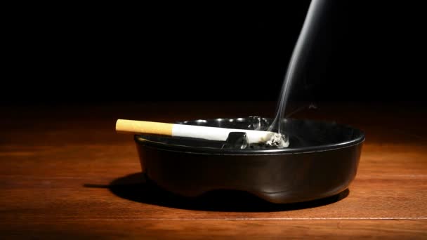Burning Cigarette Classic Black Ashtray Streaming Smoking Dark Moody Setting — Stock Video