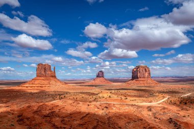 Scenic view of the magnificent buttes at Monument Valley during a bright, vibrant spring day. clipart