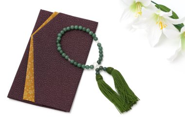 Buddhist rosary called Juzu. Buddhist tool used for praying at funeral and condolences.  clipart